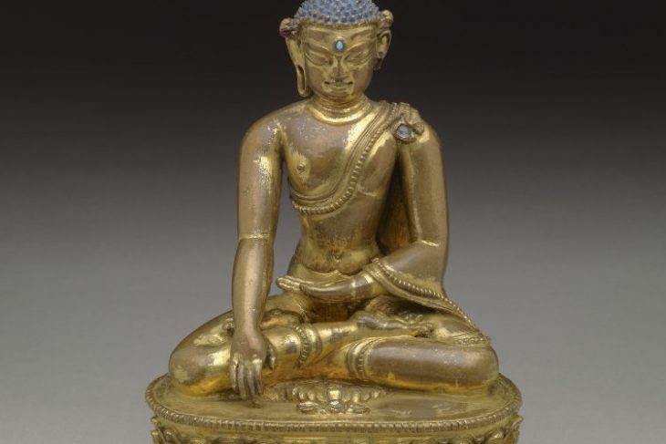 Buddha sitting in vajrasana on double lotus base