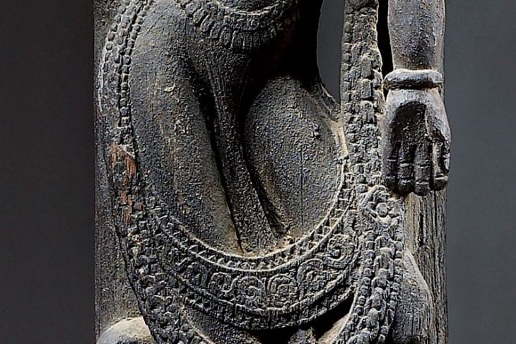 A CARVED WOOD PILLAR DEPICTING KAMA