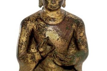 A gilt copper figure of Buddha