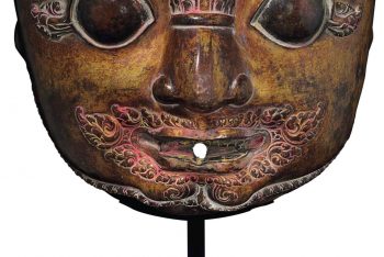 A gilt copper repousse mask of Bhairava