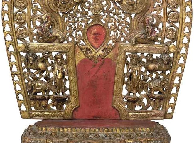 A gilt and polychromed wooden torana and pedestal