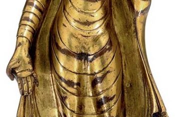 A gilt copper figure of Buddha