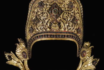A GILT-COPPER REPOUSSÉ CROWN OF INDRA INLAID WITH PASTE AND SEMI-PRECIOUS STONES Nepal, 17th Century