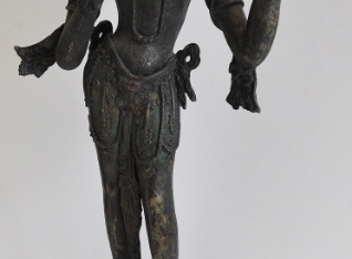 Dhūpa-Tārā standing on a round lotus base