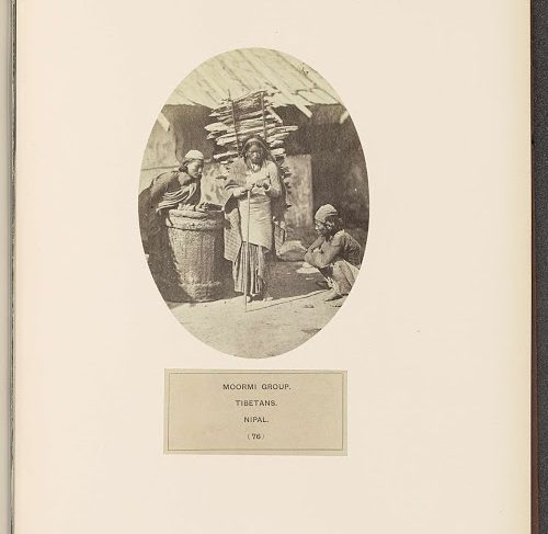 Three Moormi people from Nepal, in the middle a woman carrying wood on her back