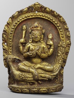 A GILT COPPER ALLOY REPOUSSÉ PANEL OF KUMARI