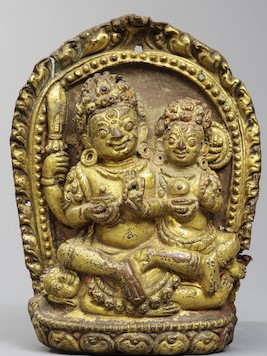 A GILT COPPER ALLOY REPOUSSÉ PLAQUE OF BHAIRAVA AND BHAIRAVI