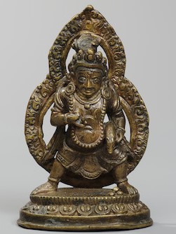 A COPPER ALLOY FIGURE OF JAMBHALA