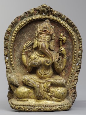 A GILT COPPER ALLOY REPOUSSÉ PLAQUE OF GANESHA