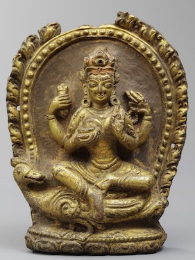 A GILT COPPER ALLOY REPOUSSÉ FIGURE OF BRAHMANI