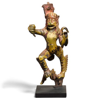 A GILT BRONZE FIGURE OF A LION