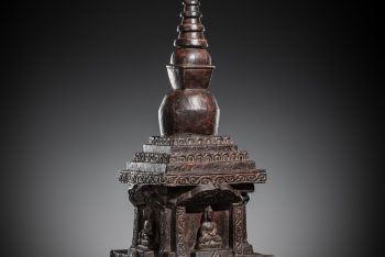 A LARGE CARVED AND LACQUERED WOOD ‘FOUR BUDDHA’ DIRECTIONAL STUPA