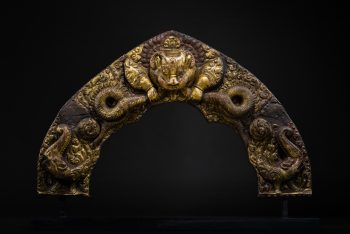 A MAGILT COPPER ALLOY REPOUSSÉ TORANA
